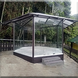 Glass-enclosed gazebo structure at Cameron Highlands, built with FRP pultruded profiles to create a sturdy, weather-resistant relaxation area.