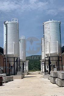 Four custom-made FRP Closed Top Tanks serving as feed silos at a chicken farm in Jeram, Kuala Selangor, approximately 10 meters in height. Mui Fatt MuiTank